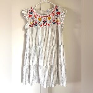 Small L.Love boutique dress with floral detail at neck